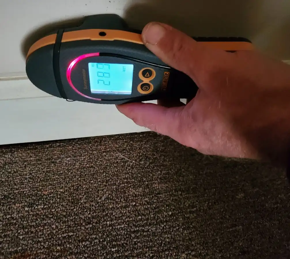 Moisture detection at baseboard during Storm Damage Restoration in Newburgh
